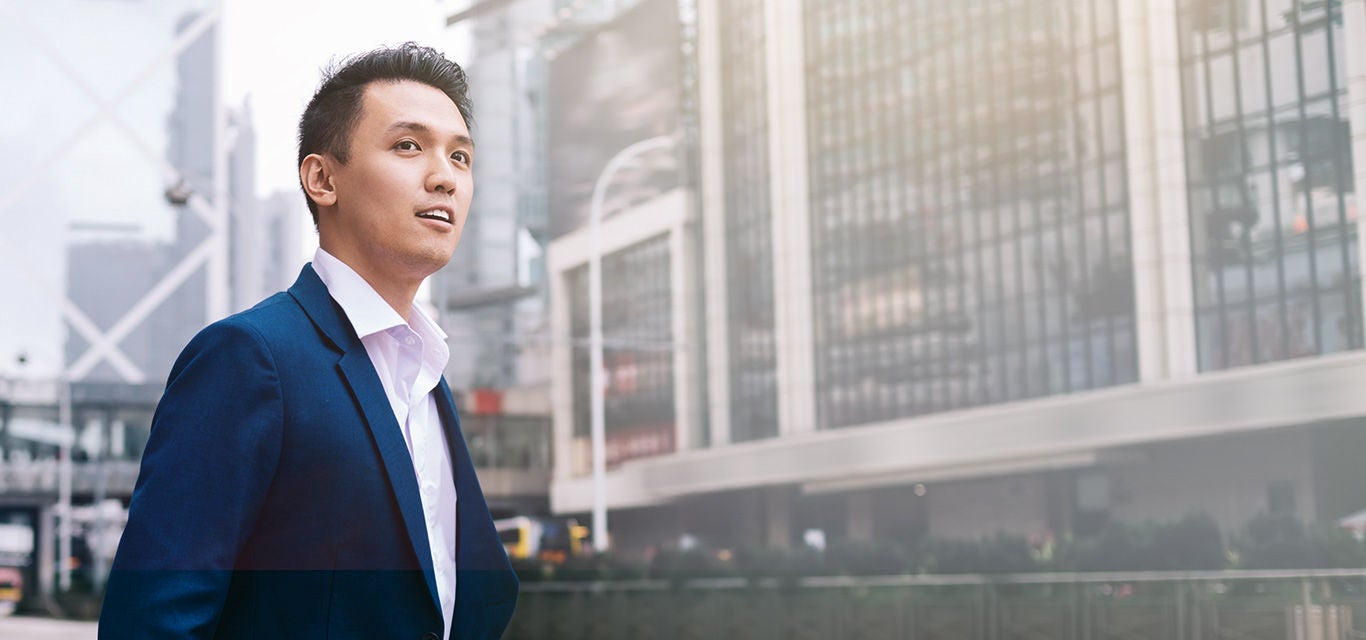 Man wearing a suit on the street.